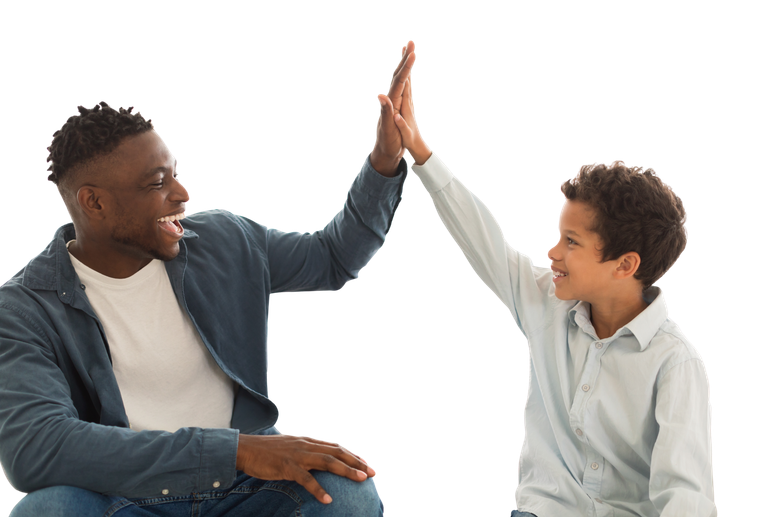 An instructor high-fives a student mid-session
